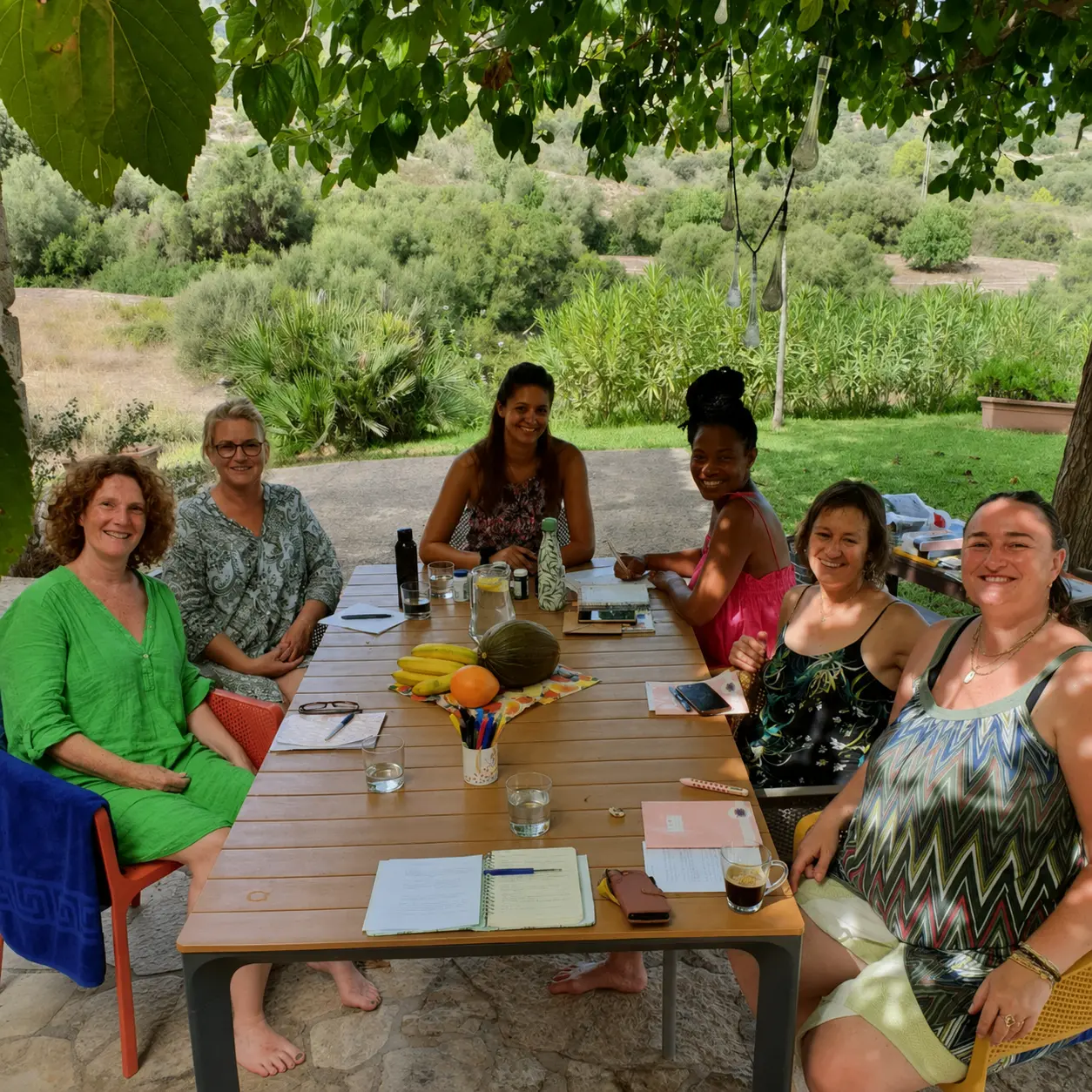 An outdoor workshop table set up in the garden during a RAZ Business Experience