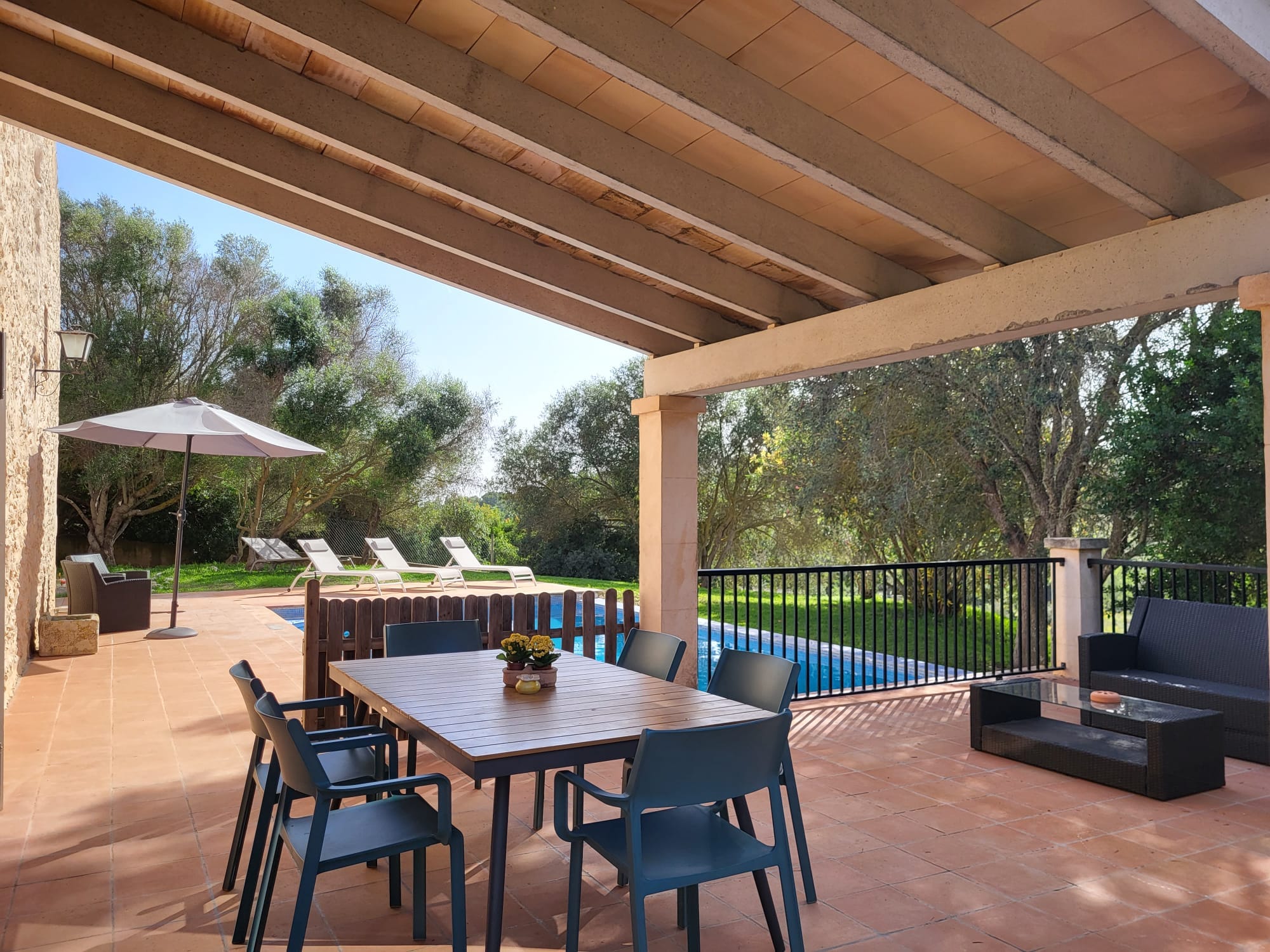 The covered terrace at Casa Romana, set for outdoor dining
